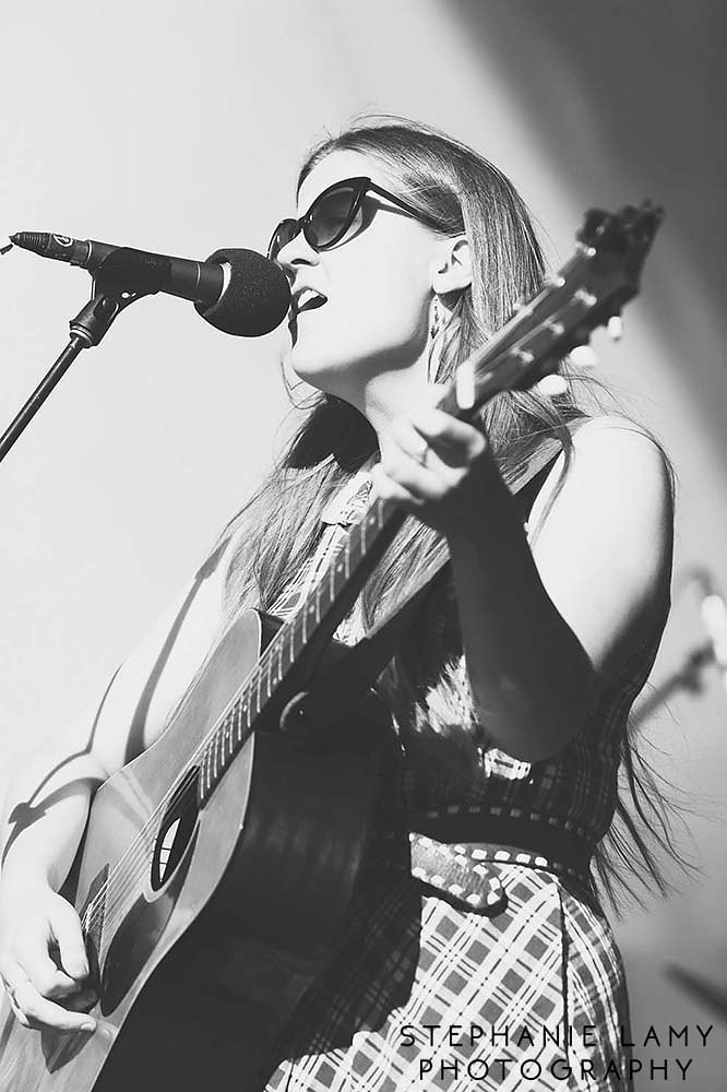 Kacy Anderson (guitar/vocals) from Kacy & Clayton from SK on Main stage during Day 2 of the Vancouver Folk Music Festival at Jericho beach park on Saturday Jul 14, 2018, in Vancouver, BC, Canada - Photo © Stephanie Lamy